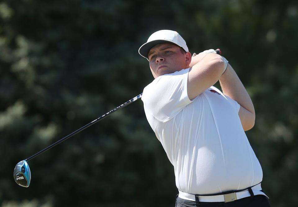 ADM's Lincoln Banwart looks at the ball after a tee during a dual boys and girls golf meet against Gilbert on Monday, April 15, 2024, at Ames Golf & Country Club.