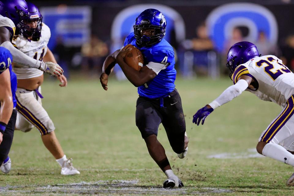 Trinity Christian running back Darnell Rogers (4) rushes for yardage during a September game against Columbia.