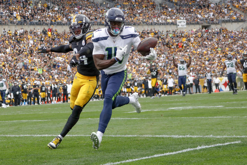Seattle Seahawks wide receiver D.K. Metcalf (14) makes a catch past Pittsburgh Steelers strong safety Terrell Edmunds (34) for a touchdown in the second half of an NFL football game Sunday, Sept. 15, 2019, in Pittsburgh. The play was reviewed and let stand as a touchdown. (AP Photo/Don Wright)
