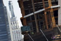 The Empire State Building is seen as construction continues on the 30 Hudson Yards building, Wells Fargo & Co.'s future offices on Manhattan's west side in New York March 22, 2016. REUTERS/Brendan McDermid