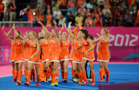 Team Netherlands celebrate their 2-0 victory over team Argentina as they walk off the field after the Women's Hockey gold medal match on Day 14 of the London 2012 Olympic Games at Hockey Centre on August 10, 2012 in London, England. (Getty Images)