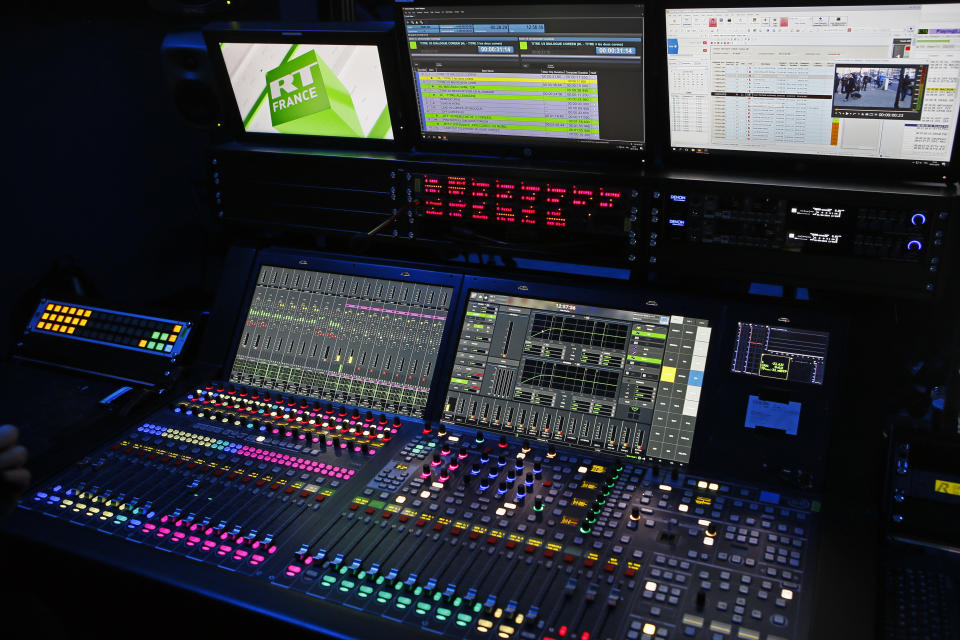 FILE - The mixing and editing desk at RT France is pictured in Paris, Jan. 9, 2018. Russia-backed RT television network's move to establish a news bureau in South Africa has been described as part of that government's long-term attempts to grow its influence in Africa. (AP Photo/Francois Mori, File)