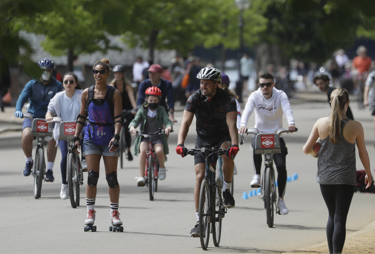 People exercise in Hyde Park as lockdown restrictions were relaxed to bring the country out of lockdown amid the coronavirus pandemic, in London, Sunday, May 17, 2020. (AP Photo/Kirsty Wigglesworth)