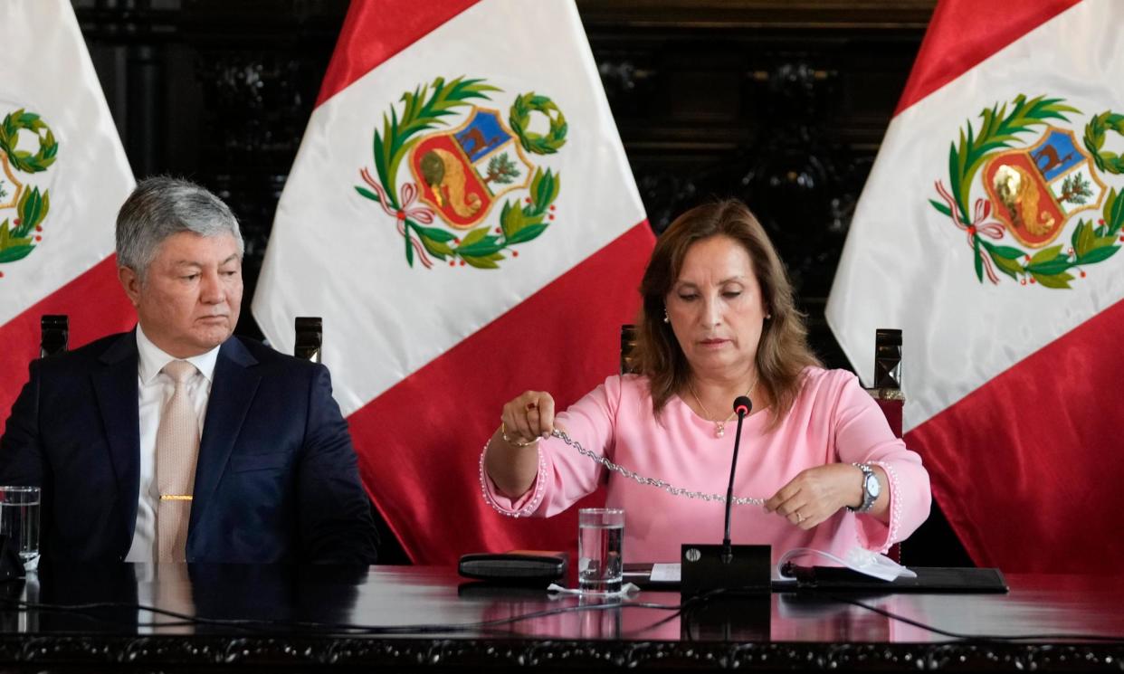 <span>President Dina Boluarte with her lawyer Mateo Castaneda in Lima in April.</span><span>Photograph: Martín Mejía/AP</span>