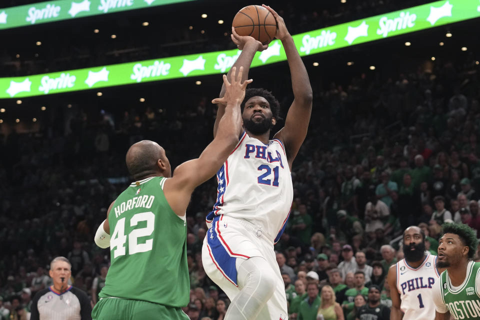 Philadelphia 76ers center Joel Embiid (21) shoots at the basket as Boston Celtics center Al Horford (42) defends during the first half of Game 7 in the NBA basketball Eastern Conference semifinal playoff series, Sunday, May 14, 2023, in Boston. (AP Photo/Steven Senne)