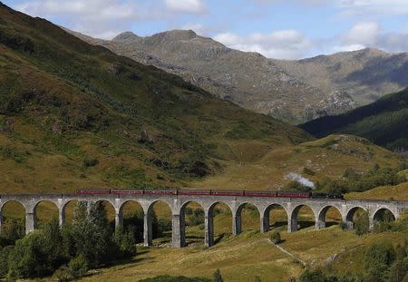 The Jacobite steam train crosses the Glenfinnan Viaduct in Scotland August 31, 2014. REUTERS/Russell Cheyne