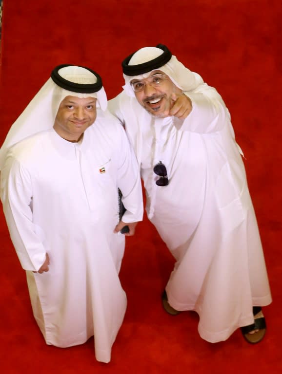 Emirati director Abdallah Juneidi (R) and producer Faisal Ali arrives for the closing ceremony of the Dubai International Film Festival in Dubai on December 13, 2017