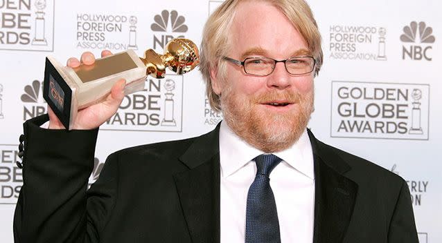 Actor Philip Seymour Hoffman poses with his award for Best Performance by an Actor in a Motion Picture-Drama for &lt;i&gt;Capote&lt;/i&gt; at the 63rd Annual Golden Globe Awards. Photo: Reuters.