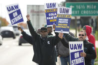 FILE - United Auto Workers members walk the picket line during a strike at the Stellantis Sterling Heights Assembly Plant, in Sterling Heights, Mich., Monday, Oct. 23, 2023. According to an annual report published Thursday, Feb. 15, 2024, from the Labor Action Tracker, a collaboration between researchers at Cornell University and the University of Illinois, those involved in work stoppages climbed 141% in 2023 — from 224,000 to 539,000 striking workers. (AP Photo/Paul Sancya, File)