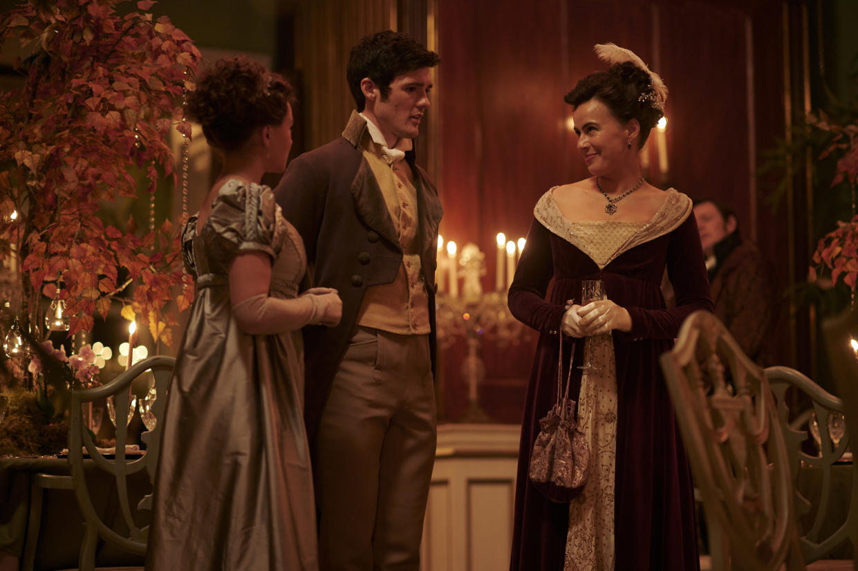  Charlotte (Rose Williams), Ralph (Cai Brigden) and Lady Susan (Sophie Winkleman) stand in conversation at Georgiana's party 