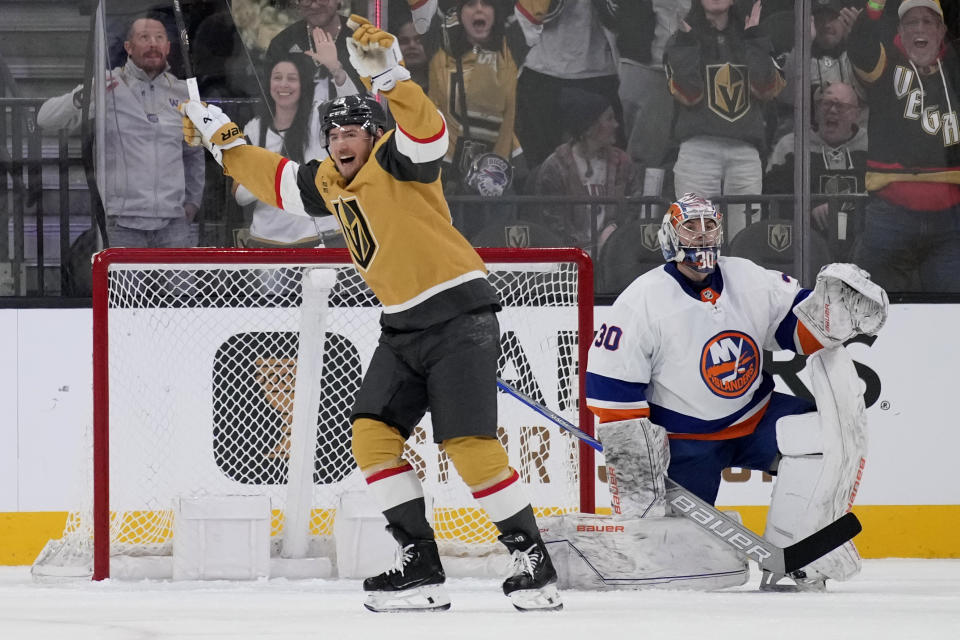Vegas Golden Knights center Ivan Barbashev, left, celebrates after center Jack Eichel scored against the New York Islanders during the first period of an NHL hockey game Saturday, Jan. 6, 2024, in Las Vegas. (AP Photo/John Locher)