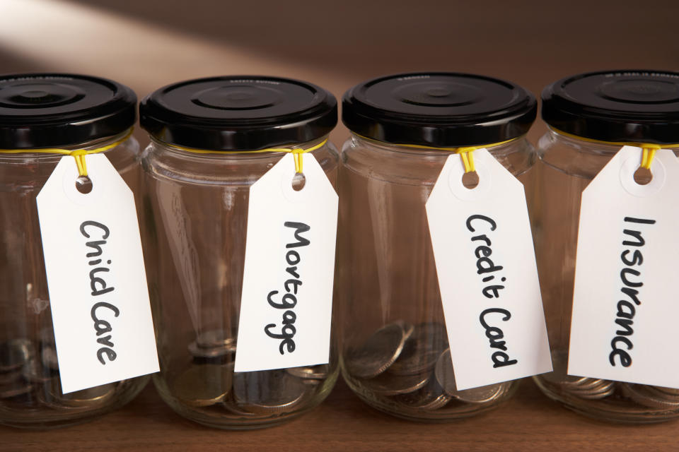 Coins in a jam jar in a row next to each other