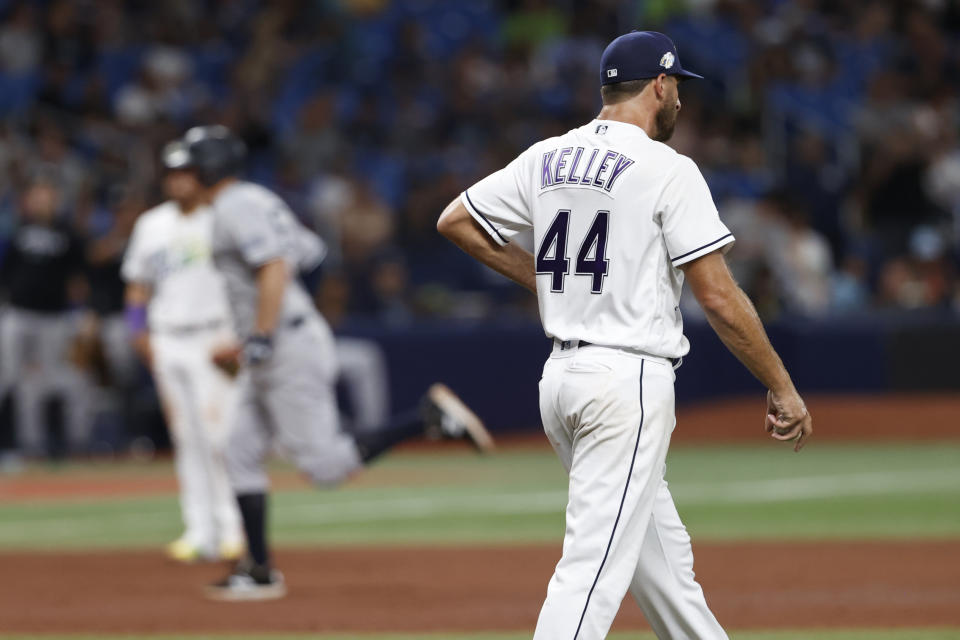 Tampa Bay Rays relief pitcher Trevor Kelley walks around the infield after giving up a home run to New York Yankees' DJ LeMahieu during the eighth inning of a baseball game Friday, Aug. 25, 2023, in St. Petersburg, Fla. (AP Photo/Scott Audette)