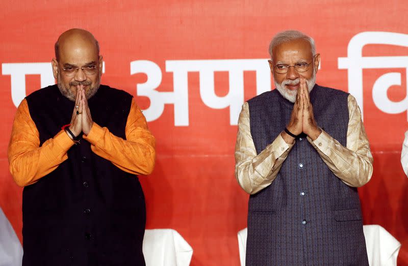 FILE PHOTO: BJP President Amit Shah and Indian Prime Minister Narendra Modi gesture after the election results in New Delhi