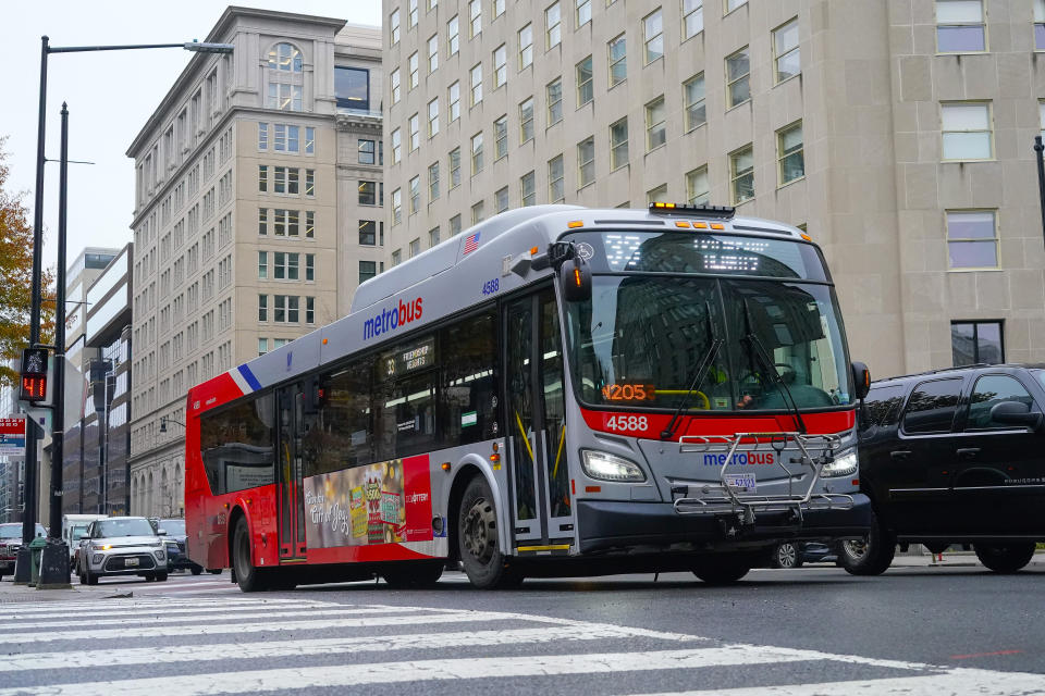 A Metrobus in downtown Washington, Wednesday, Dec. 7, 2022. The Washington DC government voted to waive fares for Metrobus rides within city limits starting July, 1, 2023, becoming the nation's most populous city to offer free public transit. (AP Photo/Pablo Martinez Monsivais)