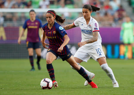 Soccer Football - Women's Champions League Final - Ferencvaros Stadium, Budapest, Hungary - May 18, 2019 Barcelona's Aitana Bonmati in action with Olympique Lyonnais' Dzsenifer Marozsan REUTERS/Bernadett Szabo