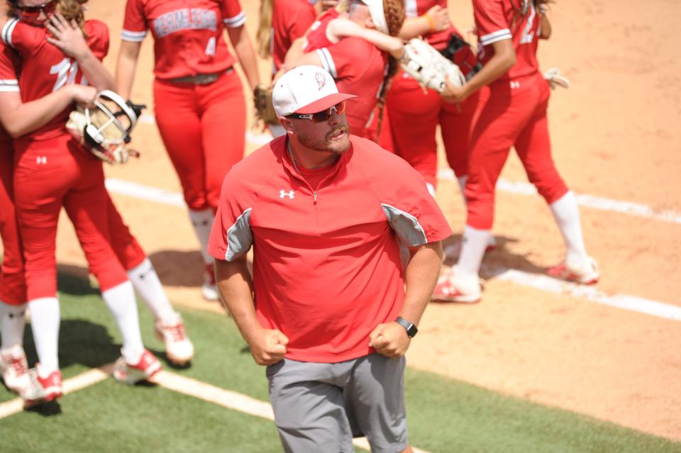 Hermleigh coach Sammy Winters celebrates after the Lady Cardinals defeated Chireno.