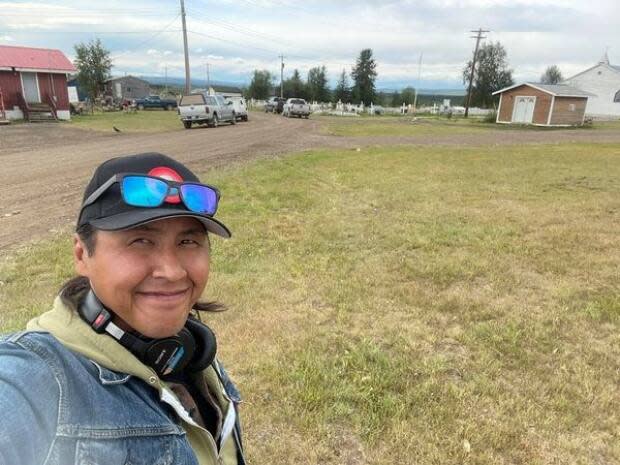 Lawrence Nayally, host of CBC North's Trails End, broadcast live from Fort McPherson, N.W.T., Wednesday. The community marked the 100th anniversary of Treaty 11 with a reenactment and gathering.  (Lawrence Nayally/CBC - image credit)