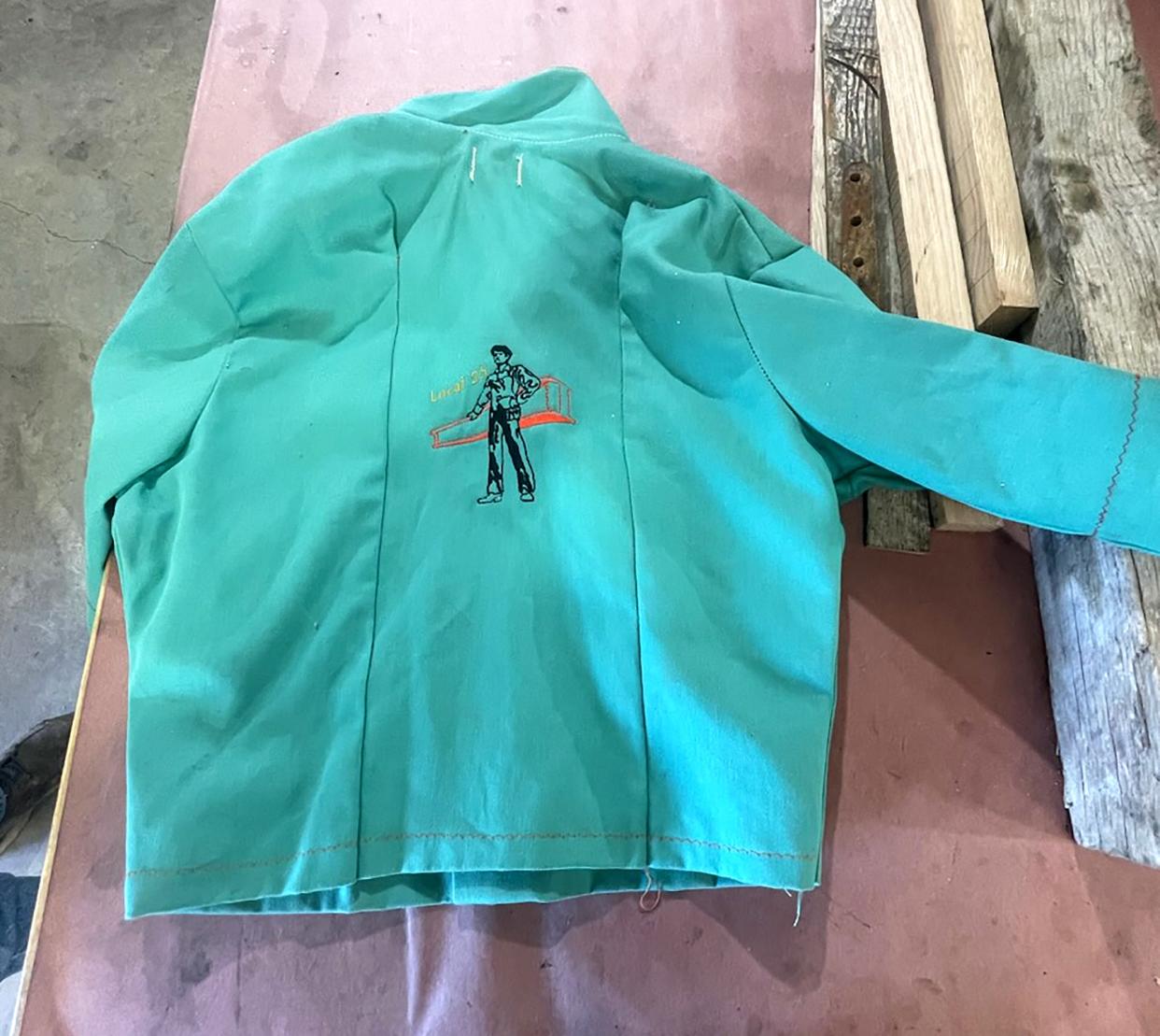 The welding jacket a young Tiffany Younk wore, which was made by her mom and embroidered with her name, for when she traveled to different projects with her dad.