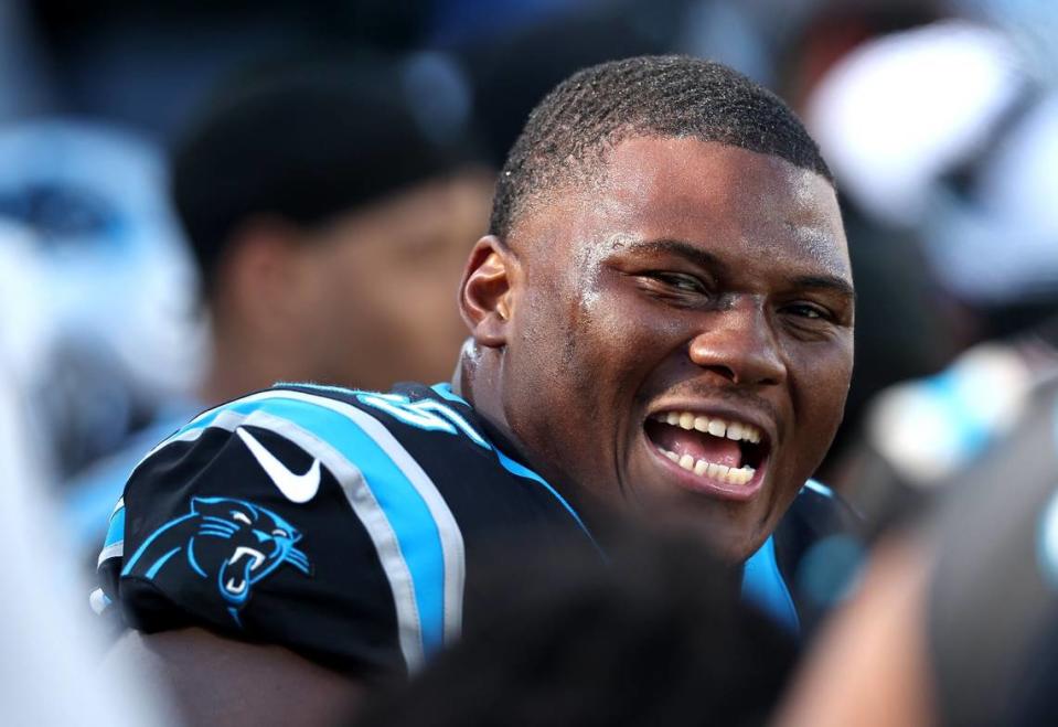 Carolina Panthers defensive end Derrick Brown smiles at his teammates following a series against the Tampa Bay Buccaneers during second-quarter action at Bank of America Stadium in Charlotte, NC on Sunday, January 7, 2024.