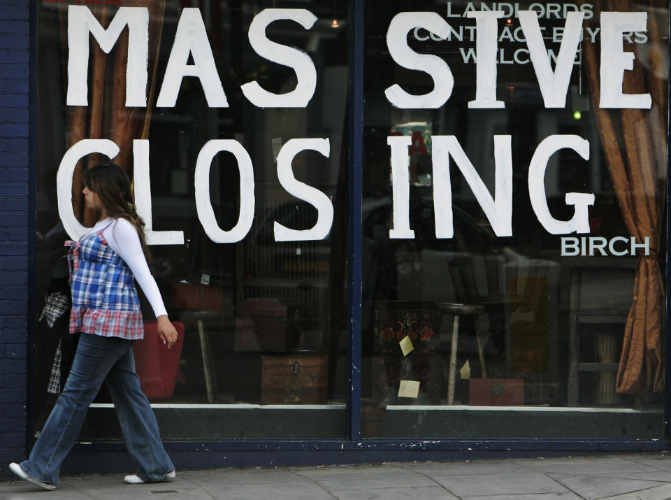 A woman walks past a shop with closing down sales signs, in west London, Friday May 1, 2009. Company insolvencies in England and Wales jumped 56 percent in the first quarter compared to a year ago, while individual insolvencies rose 19 percent, the government said Friday in its latest count of casualties in the recession. The Insolvency Service said there were 4,941 liquidations in the first quarter, up 7.1 percent from the previous quarter. In the 12 months through the first quarter, about 1 of every 130 companies went into liquidation, it added.The 29,774 individual insolvencies reported was up 1.6 from the previous quarter. (AP Photo/Lefteris Pitarakis)