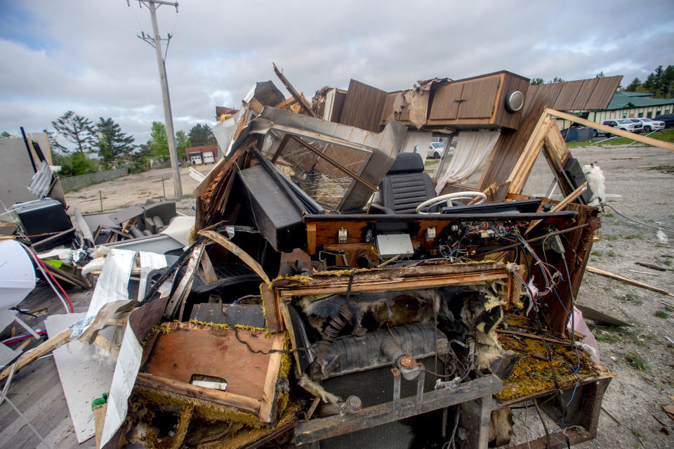 An RV sits among the rubble left behind from a tornado the day before, on Saturday, May 21, 2022, in Gaylord, Mich. (Jake May/MLive.com