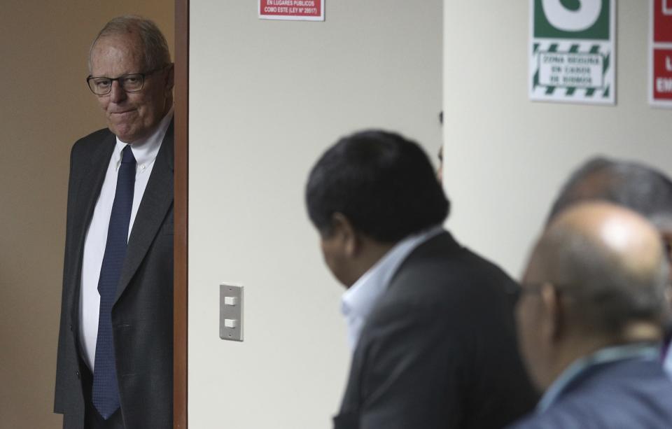 In this April 15, 2019 photo, Peru's former President Pedro Pablo Kuczynski returns to a court hearing to determine his release, in Lima, Peru. A judge in Peru ordered last week the detention for 10 days of the former leader as part of a money laundering probe into his consulting work for the company at the heart of Latin America's biggest graft scandal. (AP Photo/Martin Mejia)