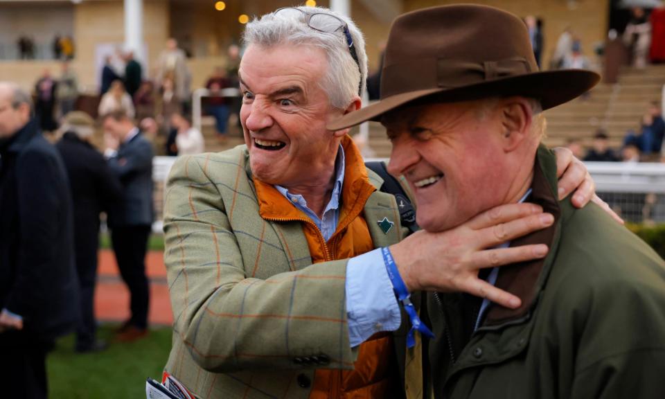 <span>Owner Michael O’Leary pretends to strangle Willie Mullins as the trainer celebrates Jasmin De Vaux gave him his 100th Cheltenham Festival victory.</span><span>Photograph: Tom Jenkins/The Guardian</span>