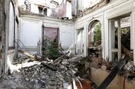 Bits of rubble inside an abandoned 19th century manor. The small farming village survived the Great War and German occupation in World War Two, but the noise from the Charles de Gualle airport was too much for its residents to bear. (Reuters)