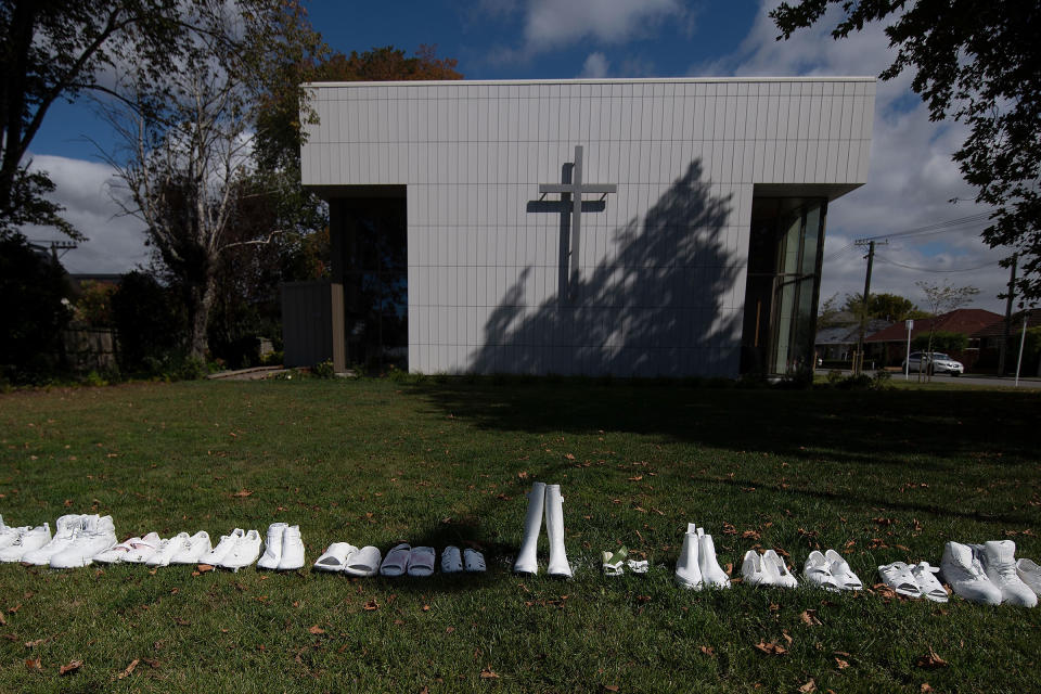 Fifty pairs of shoes lay outside the All Souls Church representing the 50 people gunned down at the two mosques in Christchurch on March 19, 2019. | Marty Melville—AFP/Getty Images.