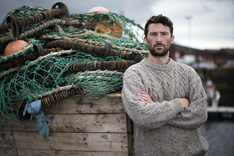 Rugged Scottish fisherman with his arms folded