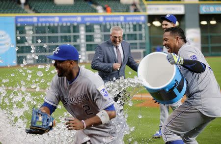 Apr 14, 2016; Houston, TX, USA; Kansas City Royals catcher Salvador Perez (13) tries to dunk ice on shortstop Alcides Escobar (2) after defeating the Houston Astros at Minute Maid Park. Royals won 6 to 2. Thomas B. Shea-USA TODAY Sports