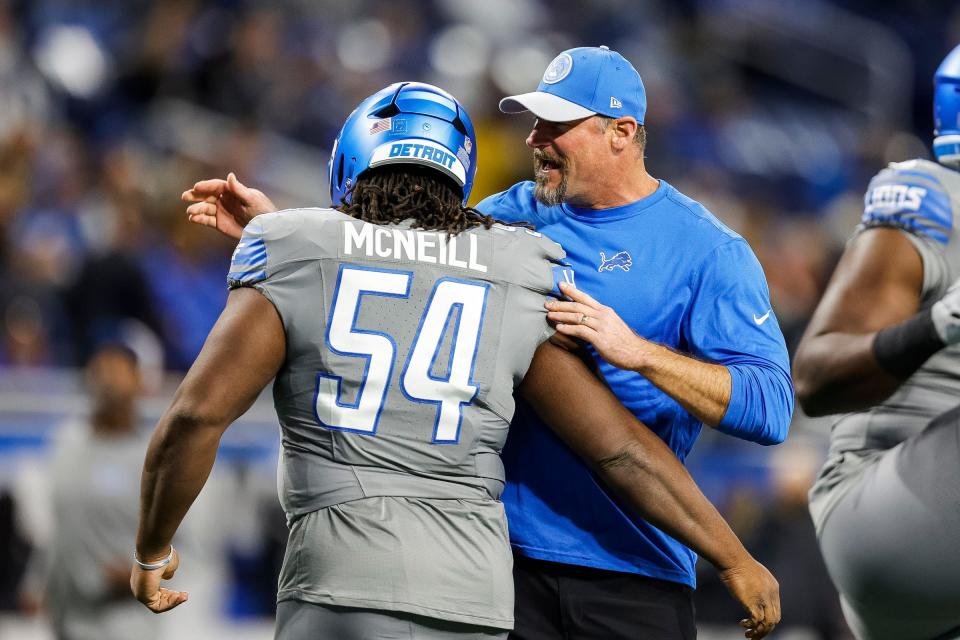 Lions coach Dan Campbell talks to defensive tackle Alim McNeill during warmups before the game against the Raiders on Monday, Oct. 30, 2023, at Ford Field.