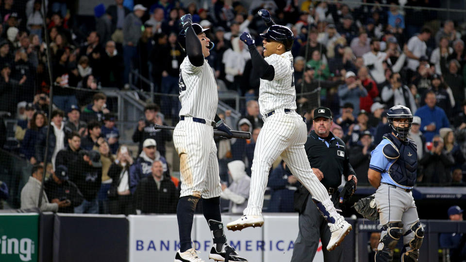 New York Yankees right fielder Juan Soto (22) celebrates with center fielder Aaron Judge (99) after hitting a three run home run against the Tampa Bay Rays during the seventh inning at Yankee Stadium.