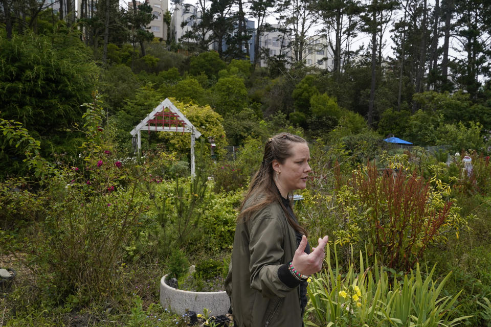 Melissa Kallstrom says the community garden, which the Jefferson Union High School District plans to raze to further develop, is a peaceful and rare green space in Daly City, Calif., Friday, July 8, 2022. The school district in San Mateo County is among just a handful of places in the country with educator housing. But with a national teacher shortage and rapidly rising rents, the working class district could serve as a harbinger as schools across the U.S. seek to attract and retain educators. (AP Photo/Godofredo A. Vásquez)