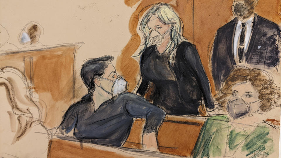 In this courtroom sketch, Michael Cohen, seated left in the back row of the courtroom, turns and looks at Stormy Daniels as she enters court to testify, in New York, Friday, Jan. 28, 2022. Testimony by Daniels at Michael Avenatti's fraud trial took a ghostly turn Friday as the porn star recounted scary moments in a haunted New Orleans home and acknowledged wishing the worst for Avenatti if he went to prison. (AP Photo/Elizabeth Williams)