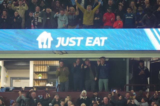 The Prince of Wales celebrates in the stands 