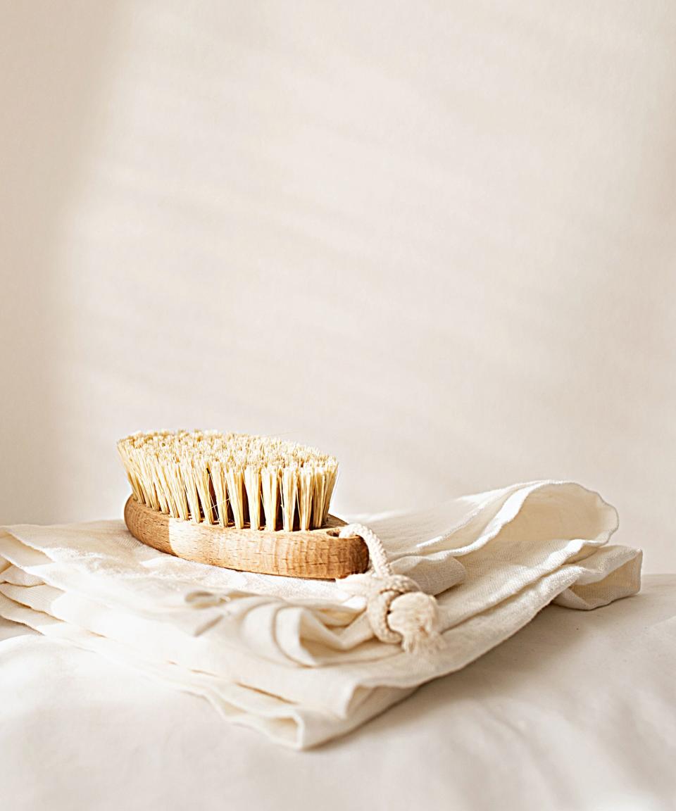 Cloths under a scrubbing brush