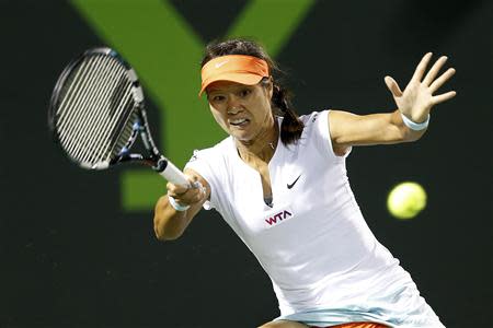 Mar 27, 2014; Miami, FL, USA; Li Na hits a forehand against Dominika Cibulkova (not pictured) on day eleven of the Sony Open at Crandon Tennis Center. Geoff Burke-USA TODAY Sports