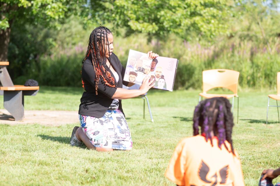 Ward 2 City Commissioner Jenasia Morris reads to R.I.S.E. Freedom School students on the Day of Social Action at Kellogg Community College on Wednesday, July 19, 2023.