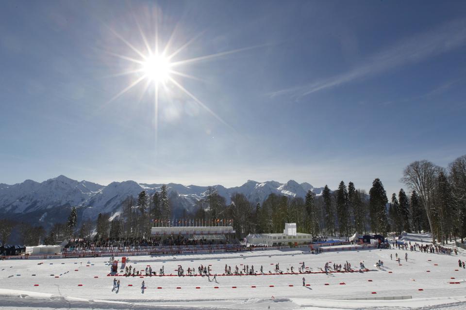 FOR STORY RUSSIA SOCHI YEAR TO GO - In this photo dated Sunday, Feb. 3, 2013, the sun shines over the ski stadium during the FIS Cross-Country World Cup in Sochi, Russia. With just one year till the opening ceremony of the winter Olympic 2014 Sochi Games, the Black Sea resort is still a vast construction site sprawling for nearly 40 kilometers (25 miles) along the coast and 50 kilometers (30 miles) up into the mountains, with no escape from the clang and clatter of the construction works, the drilling, jack-hammering and mixing of cement. (AP Photo/Igor Yakunin)