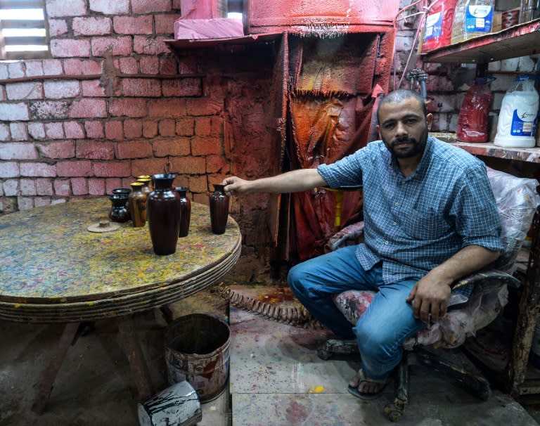 Egyptian potter Mostafa el-Agoury displays some of his pottery at his workshop in the village of Shamma, Menufiya province, on June 21, 2018