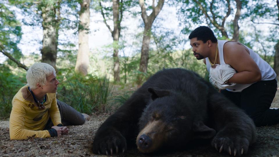 Aaron Holliday and O’Shea Jackson, Jr. next to a bear