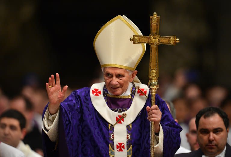 Pope Benedict XVI waves as he leaves after the mass for Ash Wednesday on February 13, 2013 at St Peter's Basilica in the Vatican. The pope may issue a decree to bring forward the start date for a conclave of cardinals to elect his successor to earlier in March, the Vatican said Wednesday