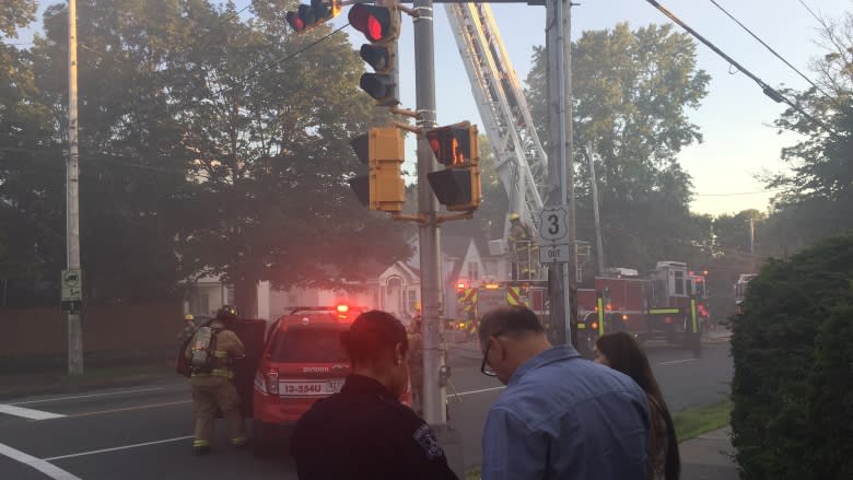 Neighbour hears loud bang as fire strikes west-end Halifax homes