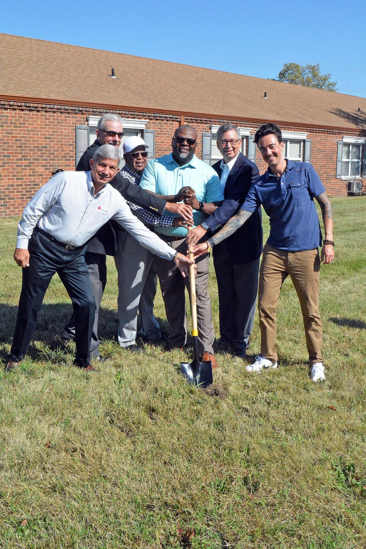 Michael Hemme with Coil Construction, from left; Matt Moore, former Shelter Insurance CEO; Russell Freeman, United Community Builders board president; Damian Dean, UCB executive director; Gary Thompson, Columbia Insurance Group CEO and president; and Erik Morse, Veterans United Foundation board president break ground Wednesday on UCB's Beacon of Light Community Center on Towne Drive.