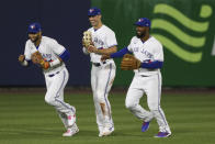 Toronto Blue Jays' Lourdes Gurriel Jr., left, Randal Grichuk, center, and Teoscar Hernandez, right celebrate the Toronto Blue Jays' 9-0 win over the Baltimore Orioles after the baseball game in Buffalo, N.Y., Thursday, June 24, 2021. (AP Photo/Joshua Bessex)