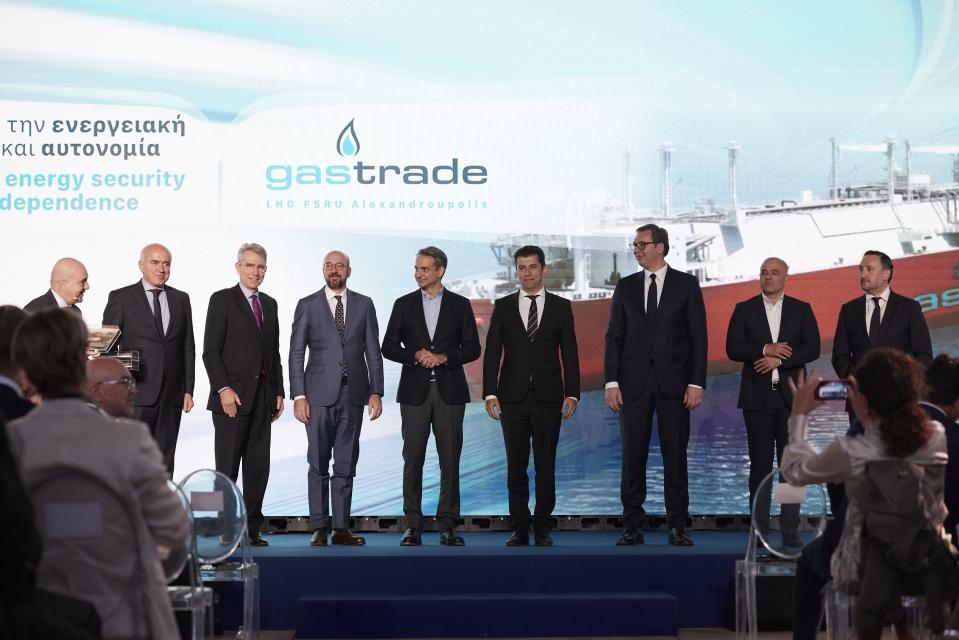 North Macedonia's Prime Minister Dimitar Kovachevski, second right, Serbian President Aleksandar Vucic, third right, Bulgaria's Prime Minister Kiril Petkov, fourth right, Greece's Prime Minister Kyriakos Mitsotakis, center, and European Council President Charles Michel, fourth left, pose with other officials during a ceremony at the port of Alexandroupolis, northern Greece, Tuesday, May 3, 2022. Top European Union official Charles Michel is joining the leaders of four Balkan countries on a tour of liquefied natural gas facilities being built in northern Greece to challenge Russia's energy dominance in the region. (Dimitris Papamitsos/Greek Prime Minister's Office via AP)