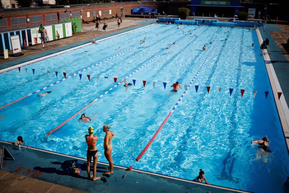 In the deep end: swimmers in the sun at Charlton Lido  (AFP via Getty Images)