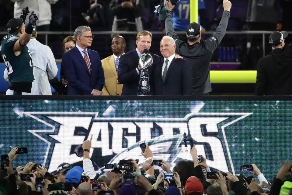 NFL commissioner Roger Goodell (middle) presents the Vince Lombardi trophy to Philadelphia Eagles owner Jeffrey Lurie after the Eagles defeated the New England Patriots 41-33 in Super Bowl LII at U.S. Bank Stadium. (Getty Images)